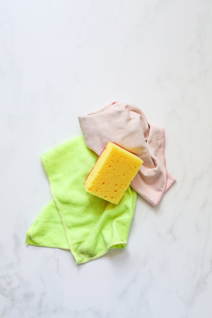 A Yellow Sponge over Cleaning Cloth